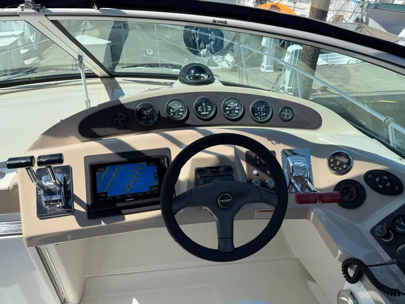 Slide: The Image of Helm of 2006 Carver 36 Mariner with navigation system and control panel. - 13