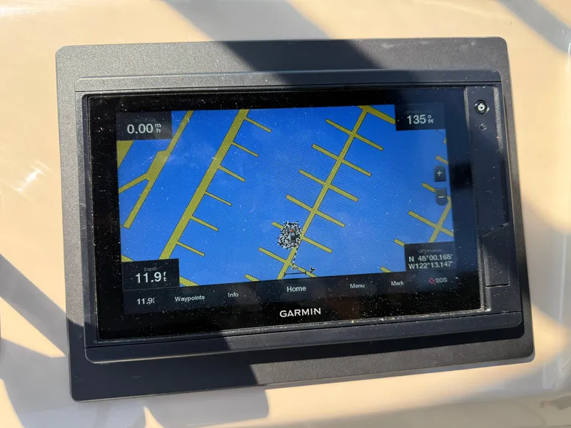 Slide: The Image of Garmin GPS display on 2006 Carver 36 Mariner, showing marina map and coordinates. - 14