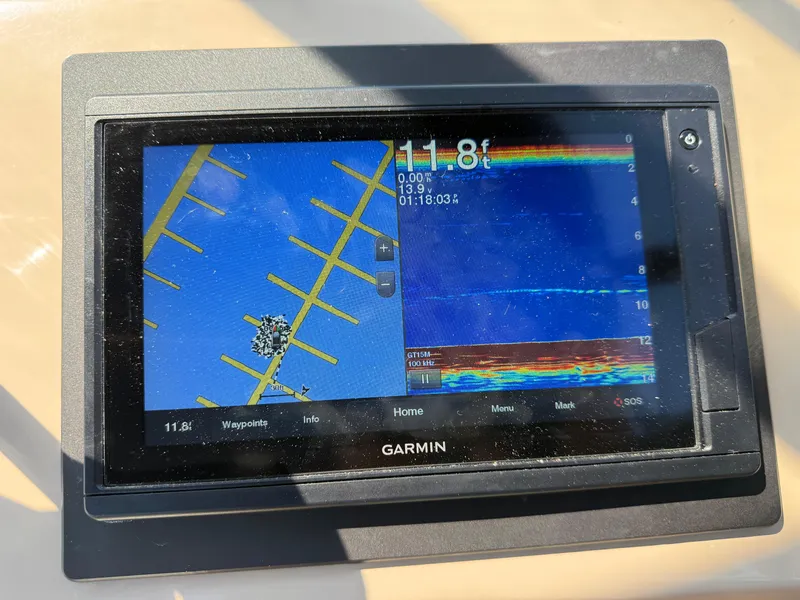 Slide: The Image of Garmin marine GPS display on 2006 Carver 36 Mariner showing depth and navigation data. - 16