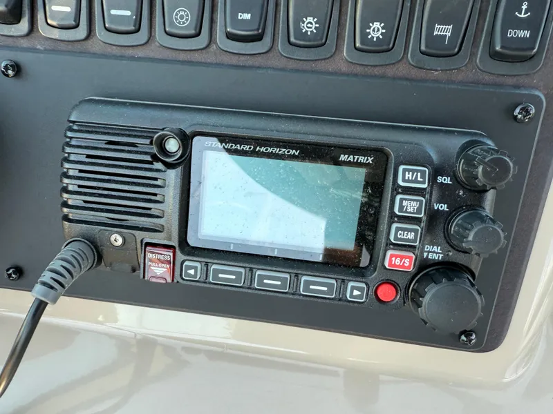 Slide: The Image of Standard Horizon Matrix radio on 2006 Carver 36 Mariner boat dashboard. - 18