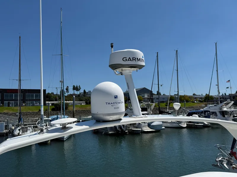 Slide: The Image of 2006 Carver 36 Mariner with Garmin and TracVision equipment in a marina setting. - 23