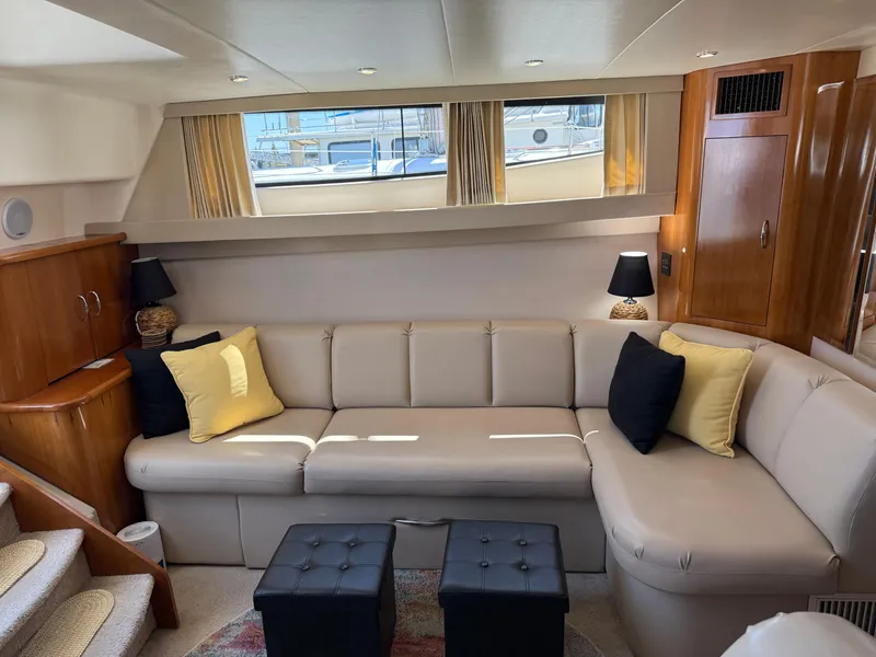 Slide: The Image of Luxurious interior of 2006 Carver 36 Mariner yacht with beige seating and elegant decor. - 26