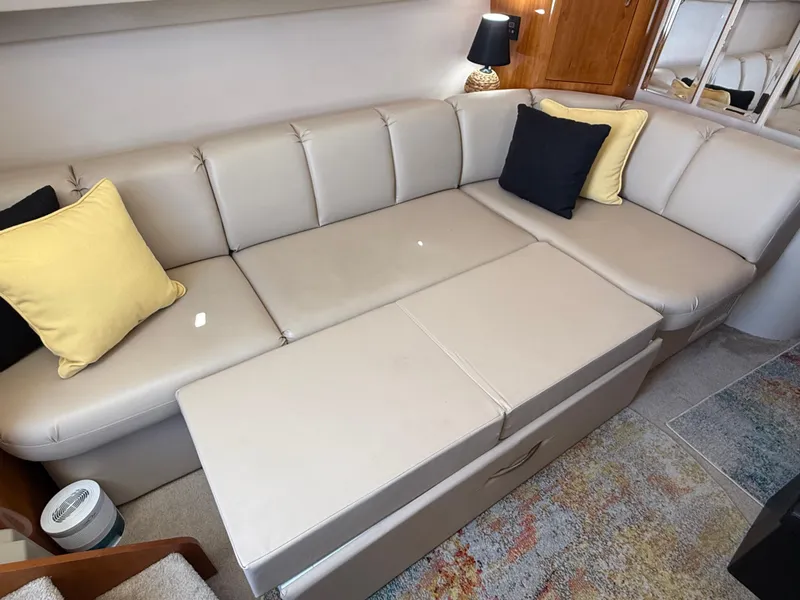 Slide: The Image of Luxurious interior of 2006 Carver 36 Mariner with beige seating and decorative pillows. - 27