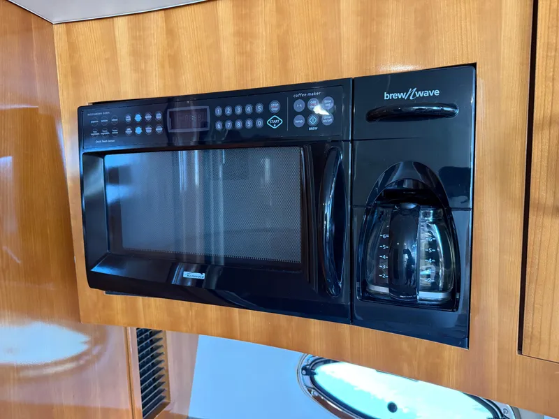 Slide: The Image of Built-in microwave and coffee maker in 2006 Carver 36 Mariner yacht kitchen. - 36