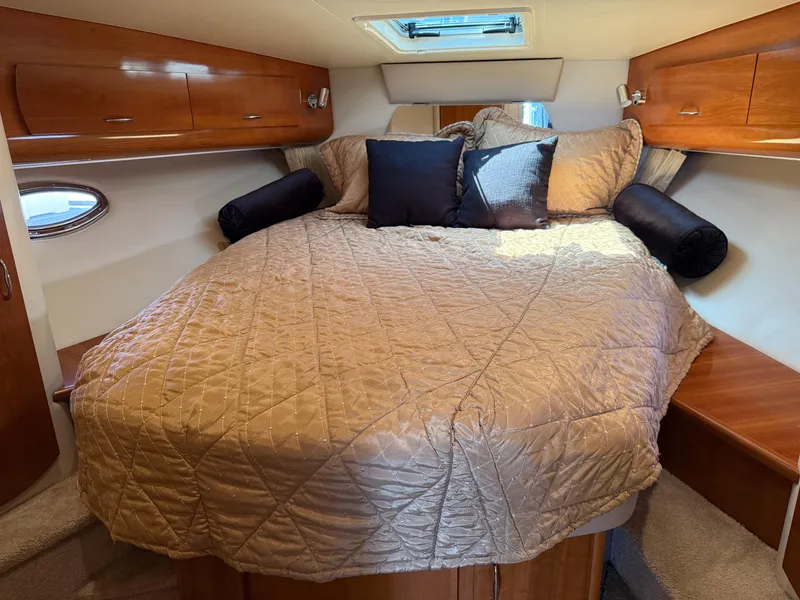 Slide: The Image of Luxurious cabin interior of 2006 Carver 36 Mariner with cozy bed and wooden cabinets. - 45