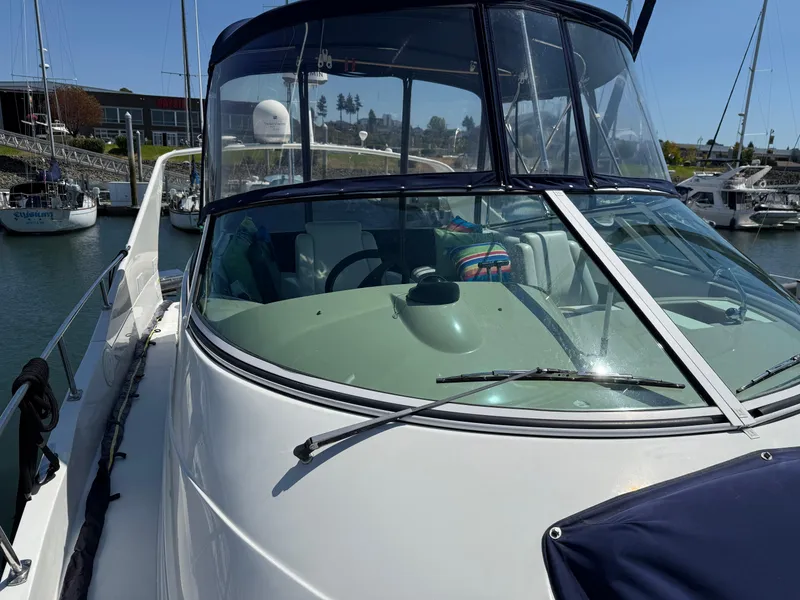 Slide: The Image of 2006 Carver 36 Mariner yacht docked at marina, featuring sleek design and spacious cockpit. - 6
