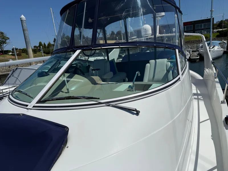 Slide: The Image of 2006 Carver 36 Mariner yacht with sleek design, docked at marina. - 7