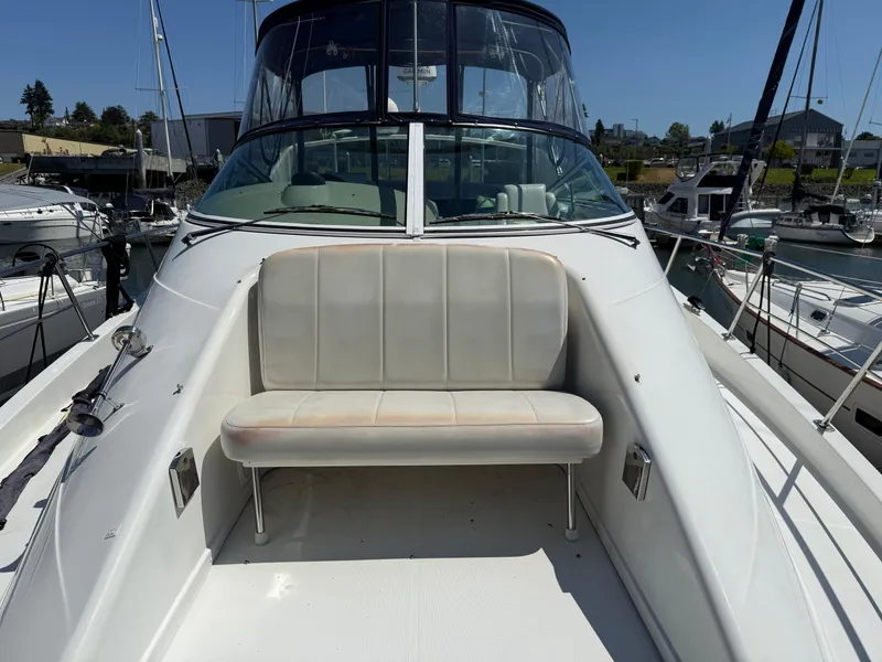 Slide: The Image of 2006 Carver 36 Mariner boat with front seating area at marina. - 8