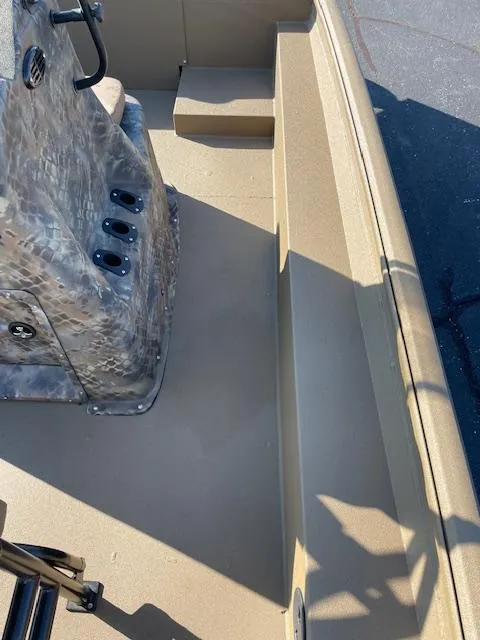 Slide: The Image of 2025 Excel 2172 Cat Pro CC boat interior with console and seating area. - 6