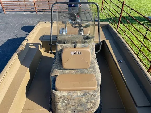 Slide: The Image of 2025 Excel 2172 Cat Pro CC boat with camouflage design and central console. - 9