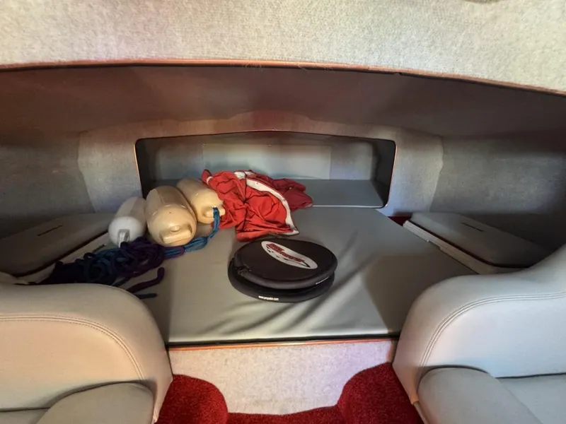 Slide: The Image of Interior cabin of a 2006 Eliminator 33 Daytona boat with storage items. - 22