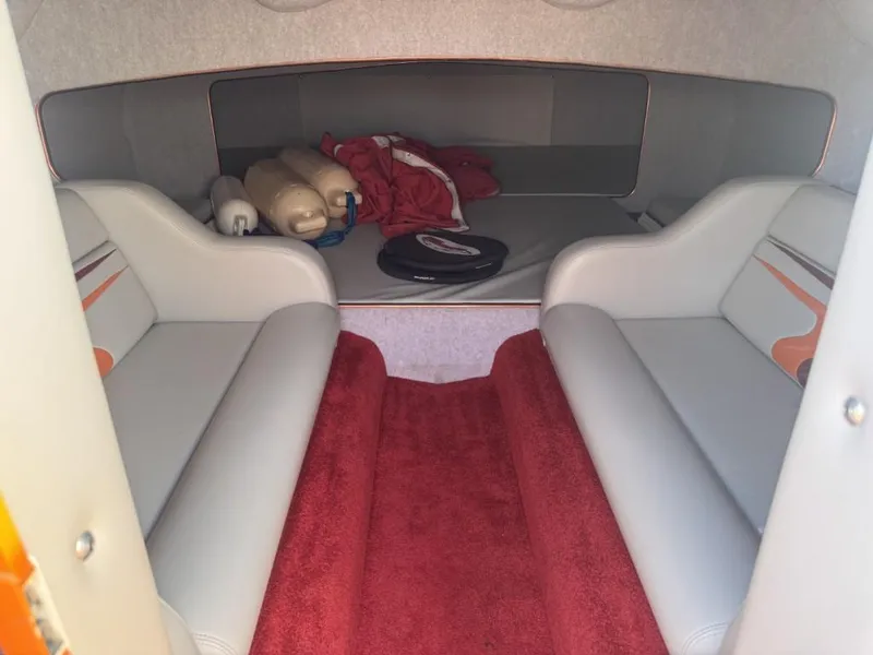 Slide: The Image of Interior cabin of 2006 Eliminator 33 Daytona boat with red carpet and seating. - 25