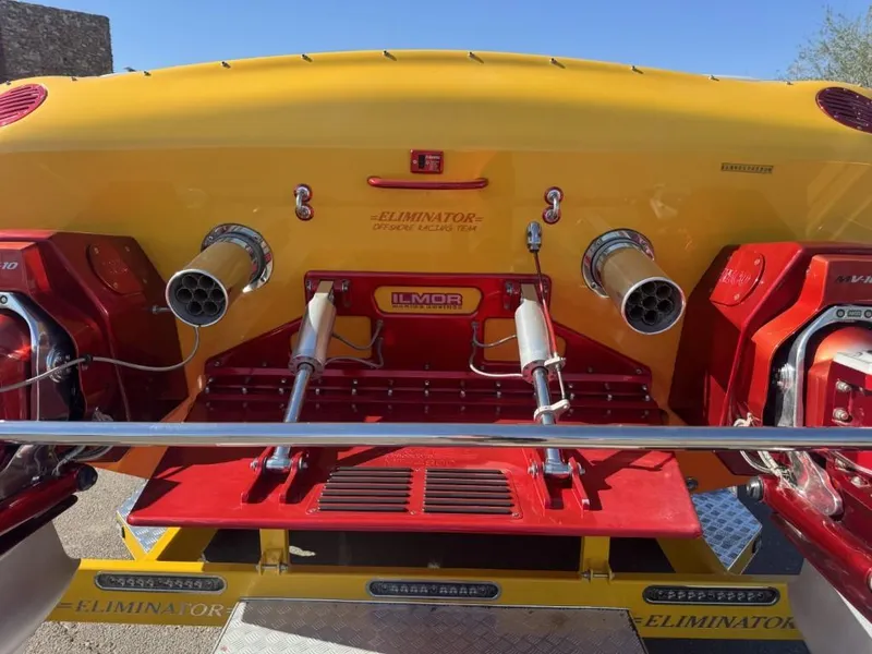 Slide: The Image of 2006 Eliminator 33 Daytona boat with Ilmor engines, vibrant yellow and red design. - 27
