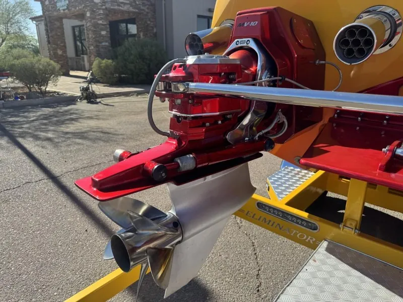 Slide: The Image of Close-up of a 2006 Eliminator 33 Daytona boat engine and propeller, showcasing sleek design. - 29