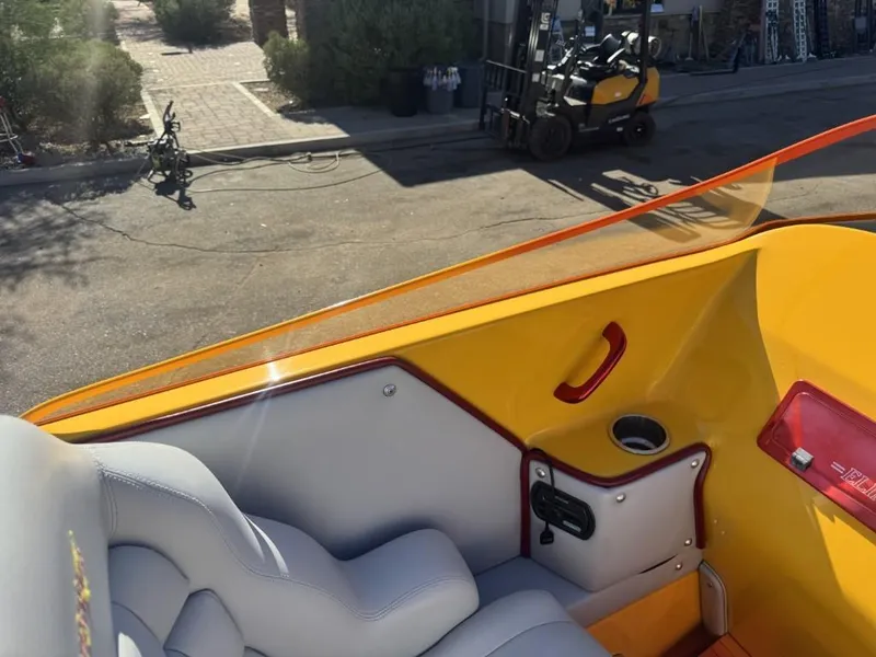 Slide: The Image of Interior of a 2006 Eliminator 33 Daytona boat with yellow and gray seating. - 36