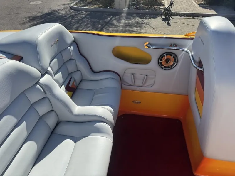 Slide: The Image of Interior of a 2006 Eliminator 33 Daytona boat with white and orange seating. - 38