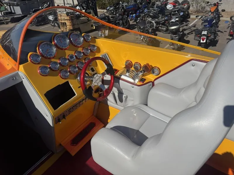 Slide: The Image of Interior of a 2006 Eliminator 33 Daytona boat with gauges and steering wheel. - 40