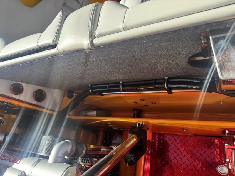 Slide: The Image of Interior view of a 2006 Eliminator 33 Daytona boat, showcasing engine components and seating. - 43