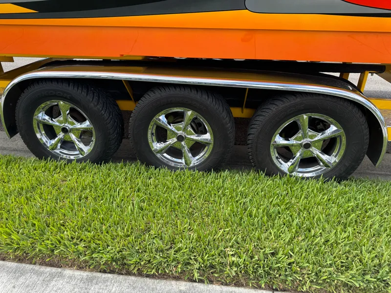 Slide: The Image of Triple axle trailer with chrome wheels for 2006 Eliminator 33 Daytona boat. - 7