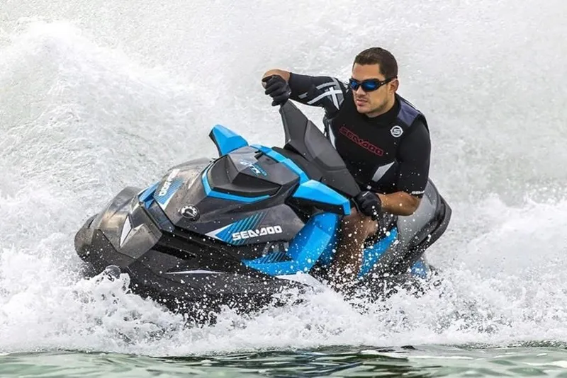 Slide: The Image of Manufacturer Provided Image: Man riding 2019 Sea-Doo GTR 230 jet ski on water, creating splashes. - 11