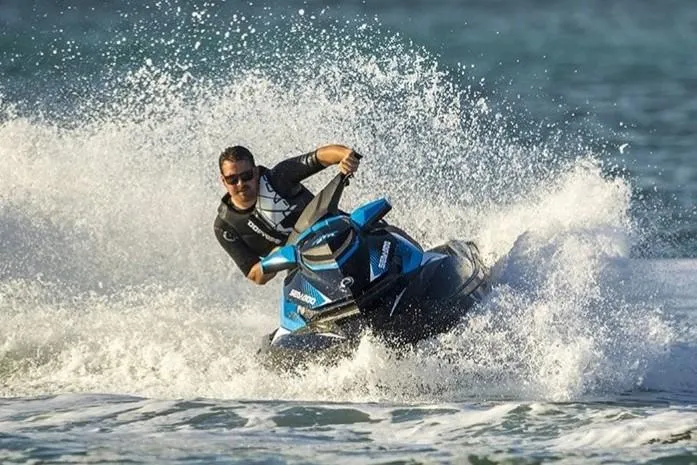 Slide: The Image of Manufacturer Provided Image: Man riding 2019 Sea-Doo GTR 230 jet ski on the ocean, creating splashes. - 12
