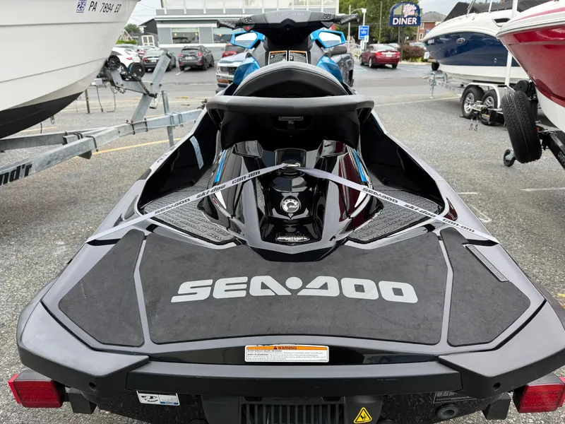 Slide: The Image of 2019 Sea-Doo GTR 230 jet ski on trailer, rear view in parking lot. - 6