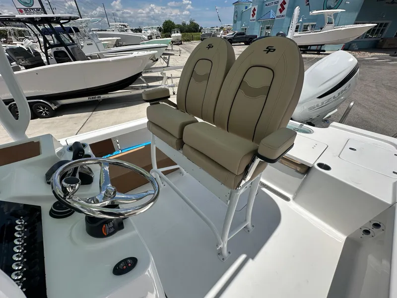 Slide: The Image of 2026 Sea Pro 250 Bay boat interior with dual seats and steering wheel. - 10