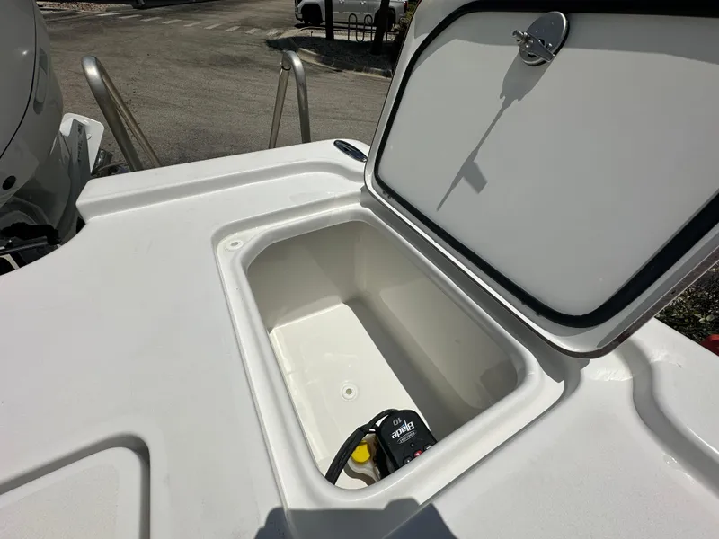 Slide: The Image of Open storage compartment on 2026 Sea Pro 250 Bay boat, showcasing interior space. - 13