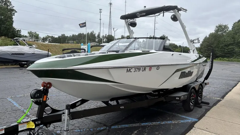 Slide: The Image of 2021 Malibu Wakesetter 21 VLX boat on trailer in parking lot. - 6