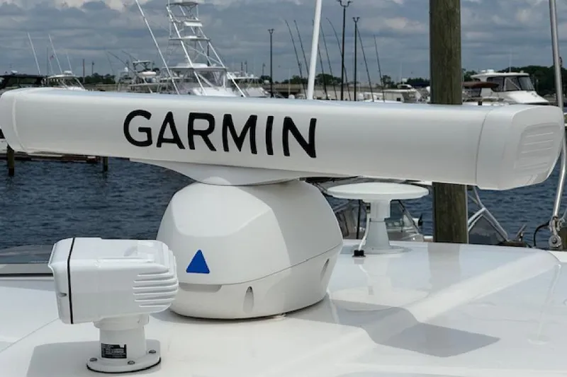 Slide: The Image of Garmin radar on 2022 Pursuit OS 385 Offshore boat, docked at marina. - 16