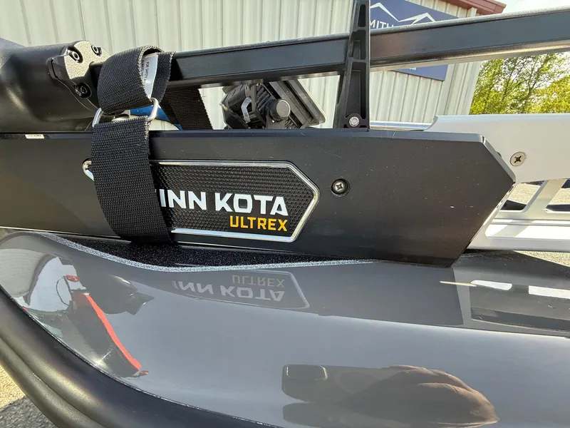 Slide: The Image of 2025 Skeeter ZXR21 with Minn Kota Ultrex trolling motor, close-up view. - 8