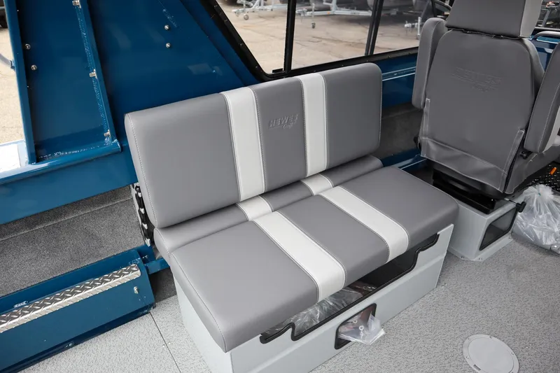Slide: The Image of 2025 Hewescraft 240 Ocean Pro ET HT interior seating, featuring gray and white cushioned seats. - 10