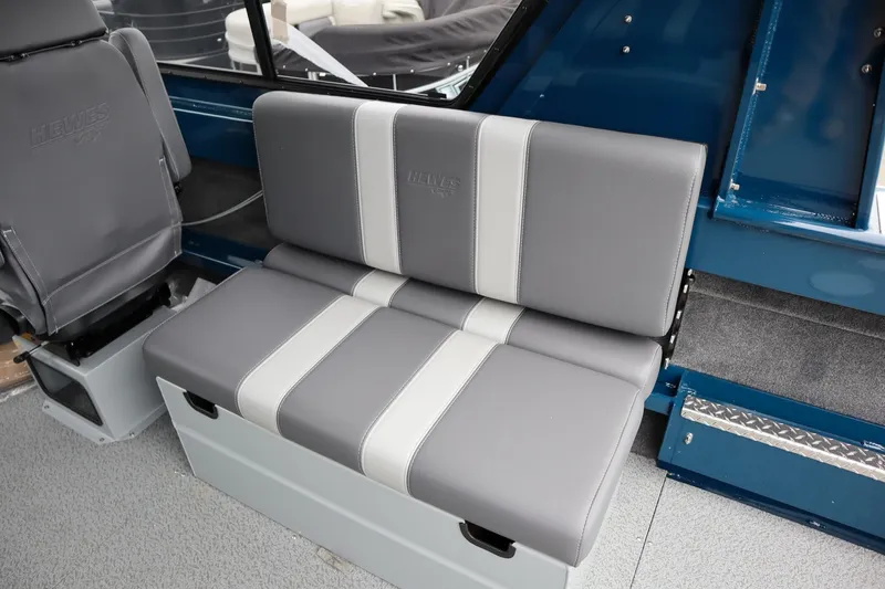 Slide: The Image of 2025 Hewescraft 240 Ocean Pro ET HT interior seating, featuring gray and white cushioned seats. - 11
