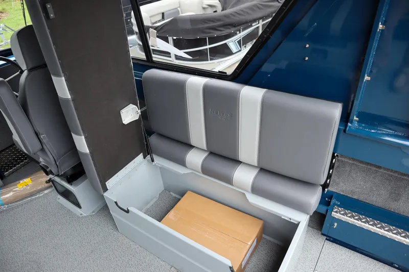 Slide: The Image of Interior of 2025 Hewescraft 240 Ocean Pro ET HT with storage under seat. - 12