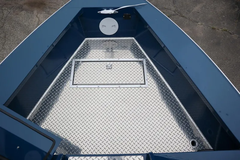 Slide: The Image of 2025 Hewescraft 240 Ocean Pro ET HT boat deck with diamond plate flooring. - 16
