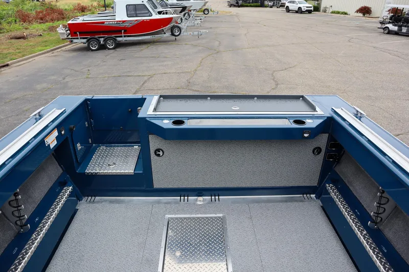 Slide: The Image of 2025 Hewescraft 240 Ocean Pro ET HT boat interior with storage compartments and non-slip flooring. - 5