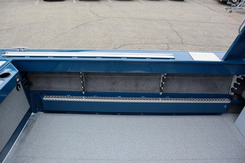 Slide: The Image of 2025 Hewescraft 240 Ocean Pro ET HT interior, showcasing storage and seating area. - 7