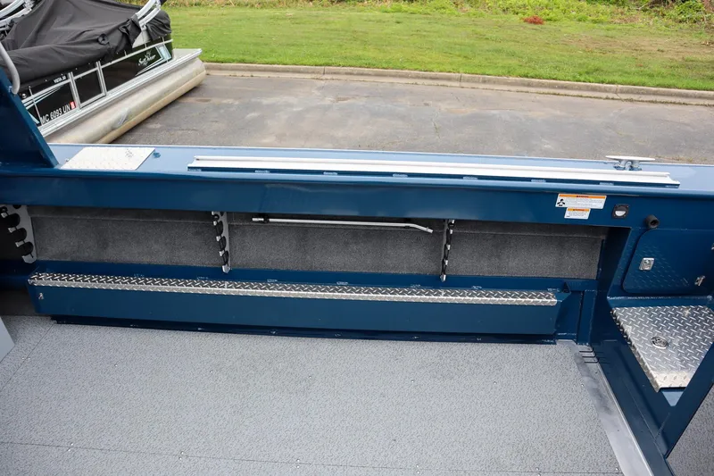 Slide: The Image of 2025 Hewescraft 240 Ocean Pro ET HT boat interior with storage compartments and diamond plate flooring. - 8