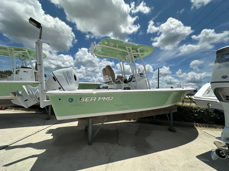 The Image of 2026 Sea Pro 230 Bay boat displayed outdoors under a cloudy sky. - 1