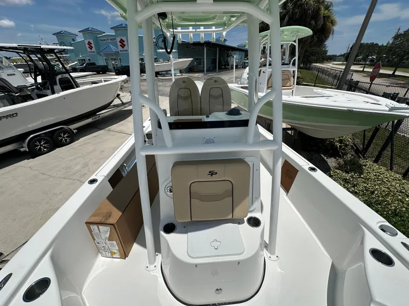 Slide: The Image of 2026 Sea Pro 230 Bay boat at a marina, showcasing seating and console. - 10