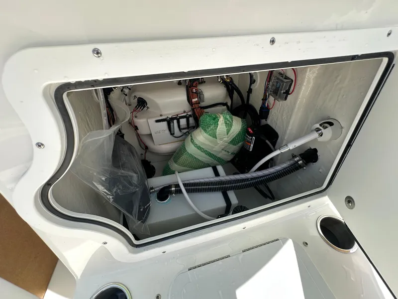 Slide: The Image of 2026 Sea Pro 230 Bay boat compartment with wiring and equipment. - 12