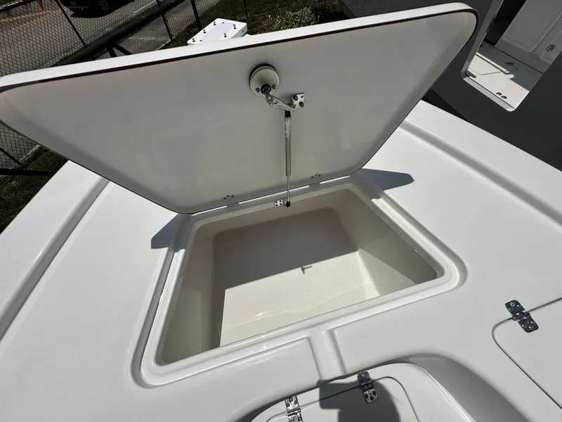 Slide: The Image of Open storage compartment on 2026 Sea Pro 230 Bay boat deck. - 7