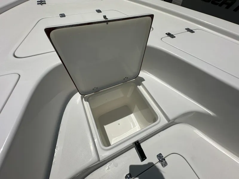 Slide: The Image of Open storage compartment on 2026 Sea Pro 230 Bay boat deck. - 8