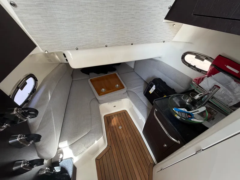 Slide: The Image of Interior of the 2026 Boston Whaler 380 Outrage with sleek cabin and wooden flooring. - 32