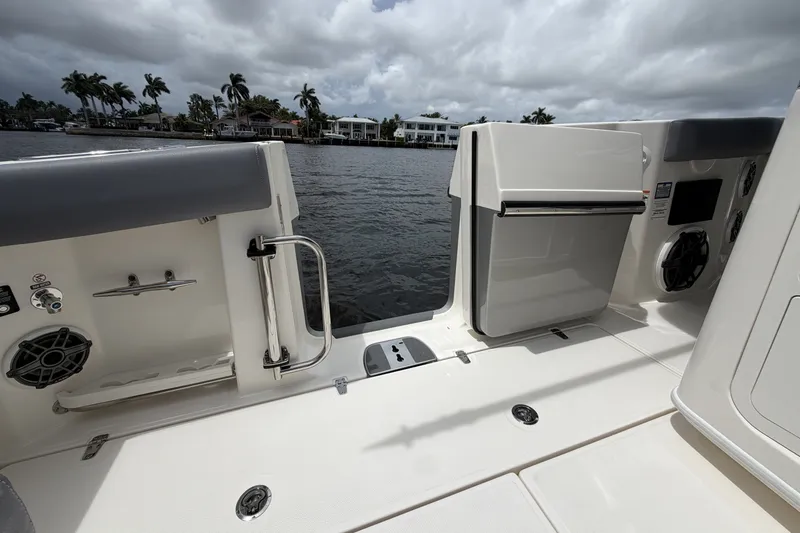 Slide: The Image of The image shows the deck of a 2027 Boston Whaler 380 Outrage overlooking the water. - 22
