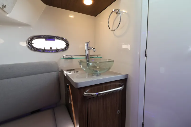 Slide: The Image of Interior of the 2027 Boston Whaler 380 Outrage with modern sink and seating area. - 47