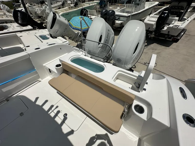 Slide: The Image of 2026 Sea Pro 262 Center Console boat with dual engines and seating area. - 14
