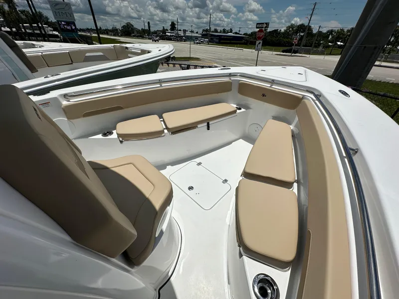 Slide: The Image of 2026 Sea Pro 262 Center Console boat interior with beige seating and sleek design. - 5