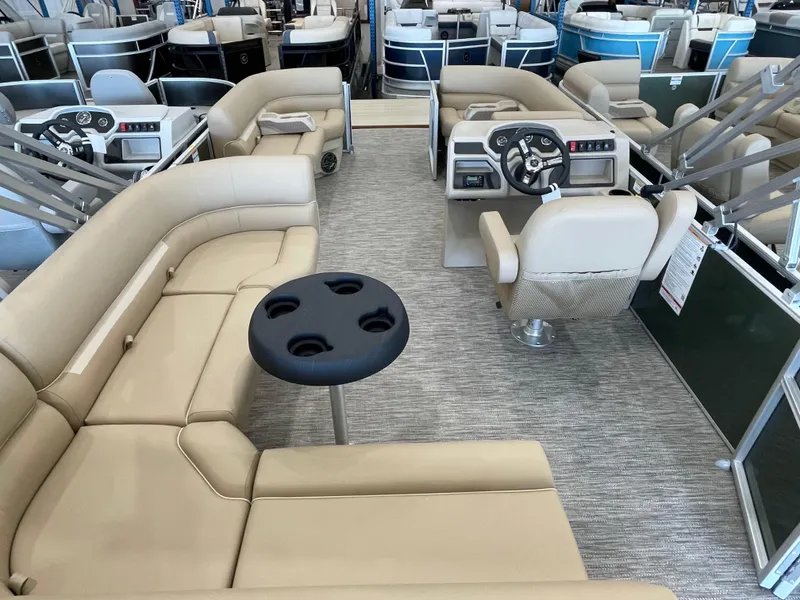 Slide: The Image of Interior of 2026 Godfrey Xperience 2086 CX pontoon boat with beige seating and steering console. - 10