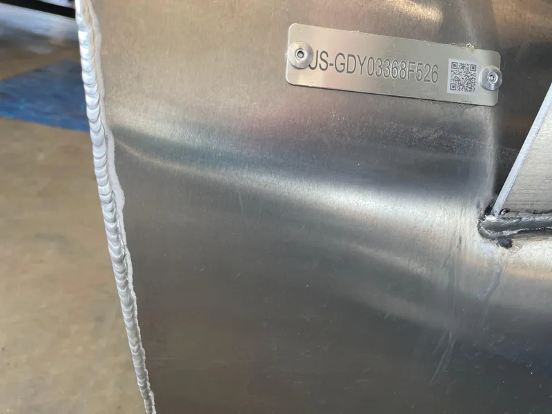 Slide: The Image of Metallic surface with a serial number plate on a 2026 Godfrey Xperience 2086 CX. - 13